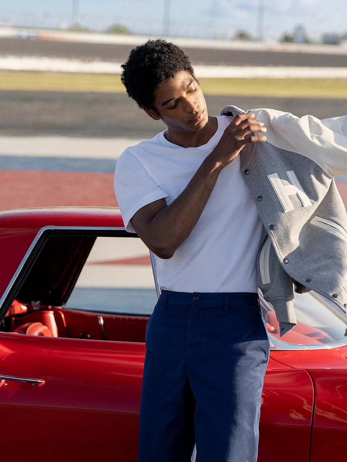 TOMMY HILFIGER MIX MEDIA VARSITY NEWSPRINT BOMBER JACKET MW0MW39684